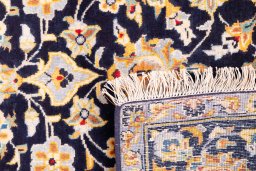 Close-up detail of 1975s Kashan rug from Iran / Persia showing Wool weave