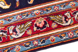 Backside of handmade 1980s Kashan rug showing knot structure and weave density