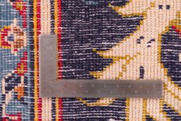 Corner detail of 1980s Kashan rug showing border pattern and Wool pile