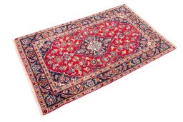 Corner detail of 2000s Kashan rug showing border pattern and Wool pile
