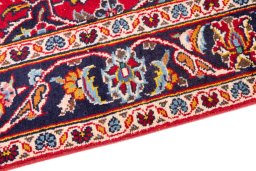 Backside of handmade 2000s Kashan rug showing knot structure and weave density