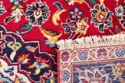 Close-up detail of 2000s Kashan rug from Iran / Persia showing Wool weave