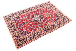 Corner detail of 2000s Kashan rug showing border pattern and Wool pile