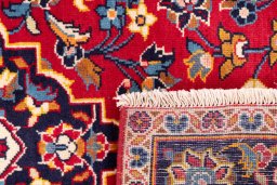 Close-up detail of 2000s Kashan rug from Iran / Persia showing Wool weave