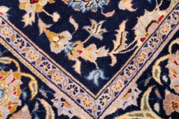 Close-up detail of 2003s Kashan rug from Iran / Persia showing Wool weave