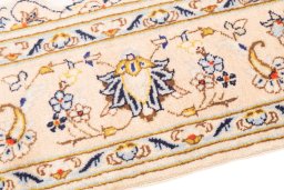 Backside of handmade 2003s Kashan rug showing knot structure and weave density