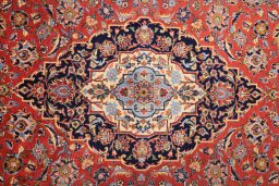 Corner detail of 1990s Kashan rug showing border pattern and Wool pile