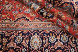 Close-up detail of 1990s Kashan rug from Iran / Persia showing Wool weave