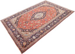 Corner detail of 1990s Kashan rug showing border pattern and Wool pile