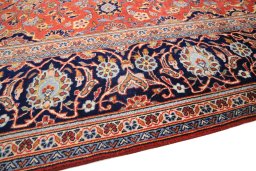 Backside of handmade 1990s Kashan rug showing knot structure and weave density