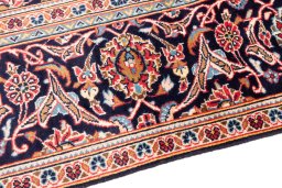 Backside of handmade 1975s Kashan rug showing knot structure and weave density