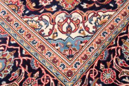Close-up detail of 1975s Kashan rug from Iran / Persia showing Wool weave