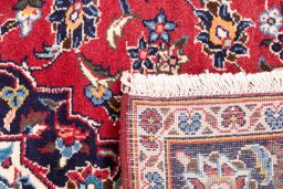 Close-up detail of 1998s Kashan rug from Iran / Persia showing Wool weave