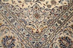 Corner detail of 1990s Kashan rug showing border pattern and Wool pile