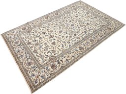 Corner detail of 2000s Kashan rug showing border pattern and Wool pile