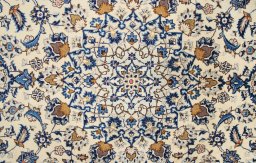 Corner detail of 2000s Kashan rug showing border pattern and Wool pile