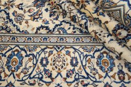 Close-up detail of 2000s Kashan rug from Iran / Persia showing Wool weave
