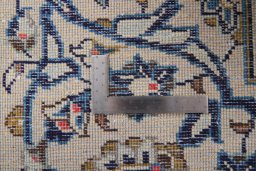 Surface texture of 2000s Kashan rug with natural Wool and intricate pattern