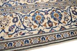 Backside of handmade 2000s Kashan rug showing knot structure and weave density