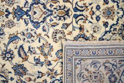 Close-up detail of 2000s Kashan rug from Iran / Persia showing Wool weave