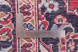 Corner detail of 1996s Kashan rug showing border pattern and Wool pile