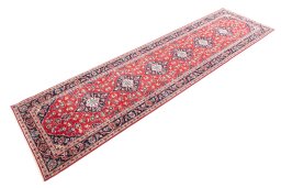 Corner detail of 1996s Kashan rug showing border pattern and Wool pile