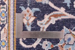 Corner detail of 1979s Kashan rug showing border pattern and Wool pile