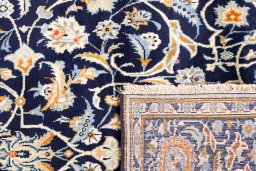Close-up detail of 1979s Kashan rug from Iran / Persia showing Wool weave