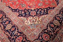 Close-up detail of 2000s Kashan rug from Iran / Persia showing Wool weave