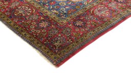 Backside of handmade 1920s Kashan rug showing knot structure and weave density
