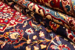 Corner detail of 1990s Kashan rug showing border pattern and Wool pile