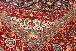 Backside of handmade 1990s Kashan rug showing knot structure and weave density