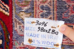 Close-up detail of 1990s Kashan rug from Iran / Persia showing Wool weave