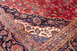 Backside of handmade 1990s Kashan rug showing knot structure and weave density