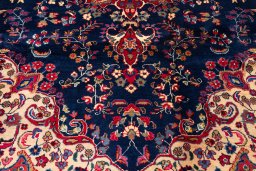 Corner detail of 1990s Kashan rug showing border pattern and Wool pile