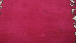 Corner detail of 2000s Kashan rug showing border pattern and Wool pile