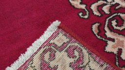 Close-up detail of 2000s Kashan rug from Iran / Persia showing Wool weave