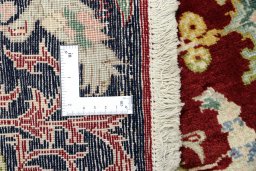Close-up detail of 1995s Kashan rug from Iran / Persia showing Wool weave