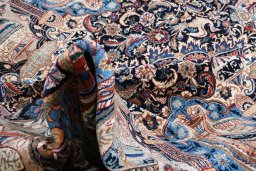 Close-up detail of 2000s Kashmar rug from Iran / Persia showing Wool weave