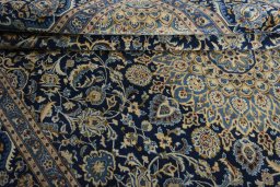 Close-up detail of 2000s Kashmar rug from Iran / Persia showing Wool weave