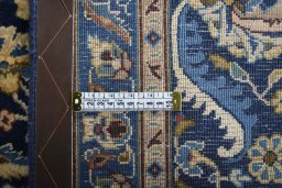 Backside of handmade 2000s Kashmar rug showing knot structure and weave density