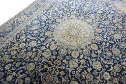 Backside of handmade 2000s Kashmar rug showing knot structure and weave density