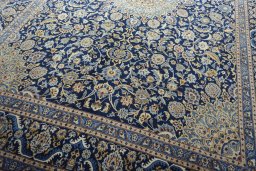 Close-up detail of 2000s Kashmar rug from Iran / Persia showing Wool weave
