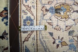 Backside of handmade 2000s Kashmar rug showing knot structure and weave density