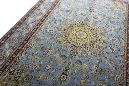 Backside of handmade 2000s Kashmar rug showing knot structure and weave density