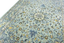 Backside of handmade 2000s Kashmar rug showing knot structure and weave density