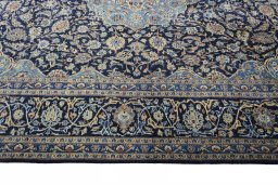 Corner detail of 2000s Kashmar rug showing border pattern and Wool pile
