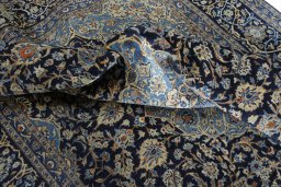 Surface texture of 2000s Kashmar rug with natural Wool and intricate pattern