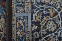 Backside of handmade 2000s Kashmar rug showing knot structure and weave density