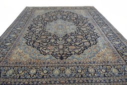 Surface texture of 2000s Kashmar rug with natural Wool and intricate pattern